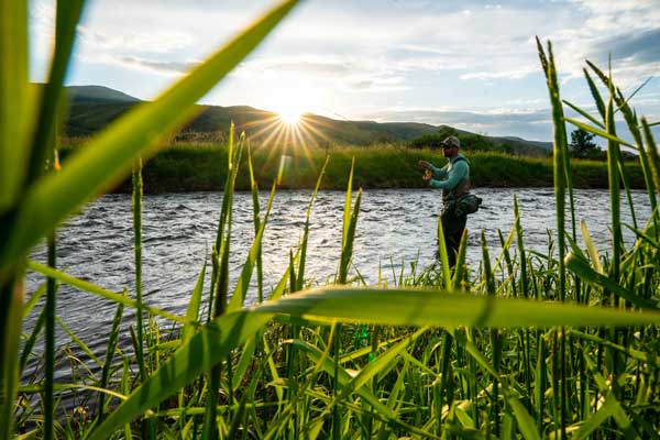 Jans expert casts a fly while fishing on a river near Park City, UT